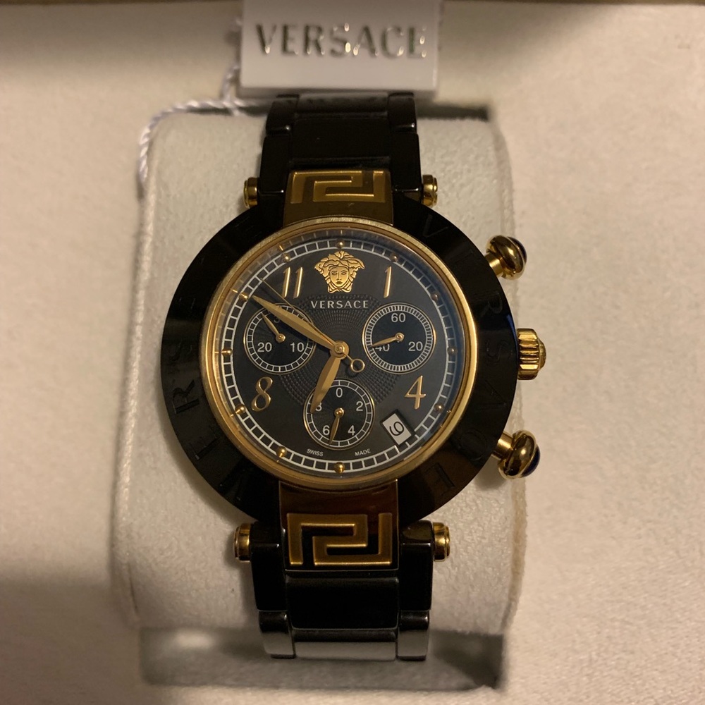 Versace authentic gold and black ladies watch.